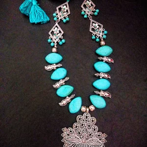 Woven Whispers - Howlite Turquoise Necklace with Peacock Pendant